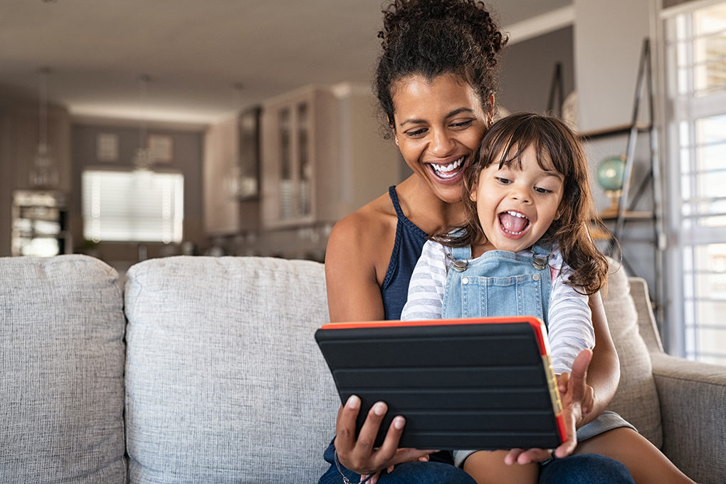 Parent and kid on tablet